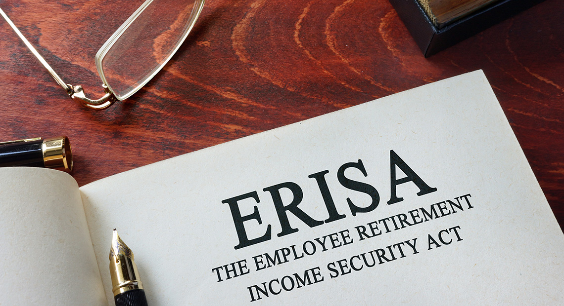 Image of a document entitled ERISA with a pair of glasses.